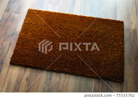 Blank Dark Brown Welcome Mat On Wood Floor Background Ready For Your Own Text Blank Dark Brown Welcome Mat On Wood Floor Background Ready For Your Own Text 75535762