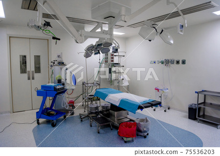 The operating room in the hospital with all the equipment in white and blue. The operating room in the hospital with all the equipment in white and blue. 75536203