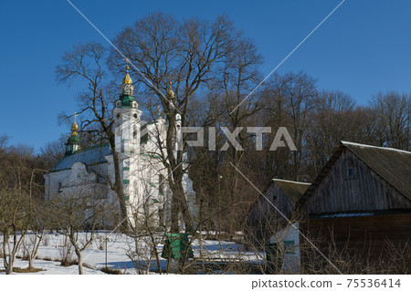Ancient orthodox church of the Holy Trinity against a rural landscape, Volno village, Baranovichi district, Brest region, Belarus. Ancient orthodox church of the Holy Trinity against a rural landscape, Volno village, Baranovichi district, Brest region, Belarus. 75536414