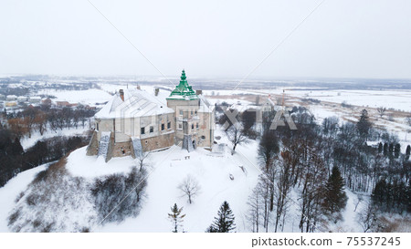 Olesko, Ukraine - 22 02 2021 : Old Olesky castle in Ukraine aerial view in winter with snow 75537245