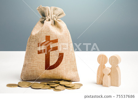 Turkish lira money bag with money and family figurines. Investments in human capital, culture social projects. Financial support for social institutions. Providing assistance to citizens. Turkish lira money bag with money and family figurines. Investments in human capital, culture social projects. Financial support for social institutions. Providing assistance to citizens. 75537686