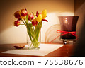 Bouquet of tulips in a glass vase 75538676