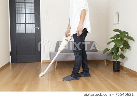 A male sucking a vacuum cleaner A male sucking a vacuum cleaner 75540621