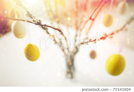 close up of pussy willow decorated by easter eggs 75543804