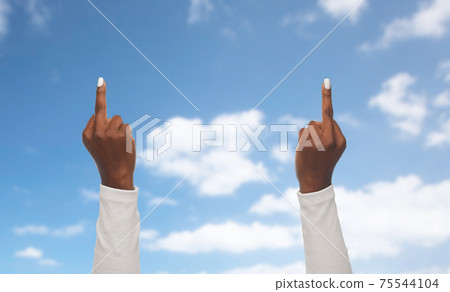 hands of african woman showing middle fingers 75544104