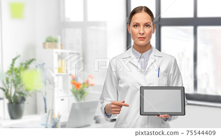 female doctor with tablet computer at hospital female doctor with tablet computer at hospital 75544409