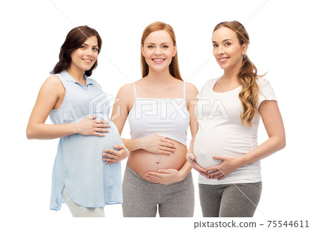 happy pregnant women touching their big bellies happy pregnant women touching their big bellies 75544611