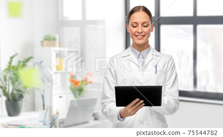 female doctor with tablet computer at hospital female doctor with tablet computer at hospital 75544782