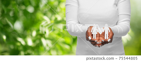 close up of african american woman holding couple 75544805