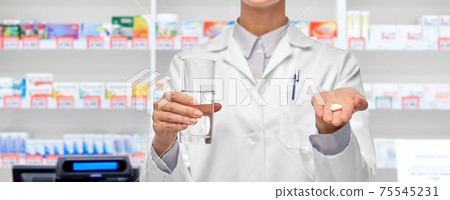 female doctor with medicine and water pharmacy 75545231