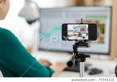 smartphone recording woman working in video editor 75545316