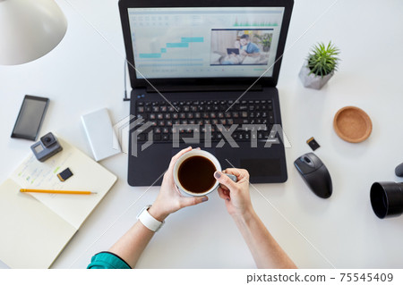 woman with video editor program on laptop at home woman with video editor program on laptop at home 75545409