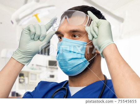 male doctor in goggles, mask and gloves 75545655