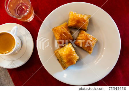 Turkish dessert baklava with honey and nuts Turkish dessert baklava with honey and nuts 75545658