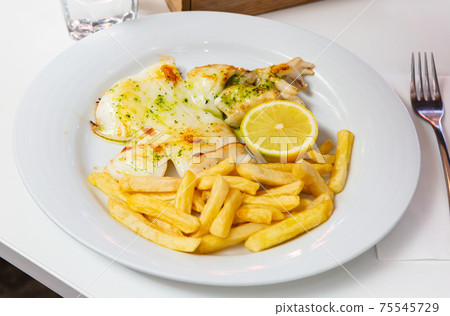 Picture of grilled tasty cuttlefish served with french fries Picture of grilled tasty cuttlefish served with french fries 75545729