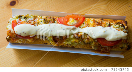 Polish zapiekanka toasted baguette with cheese and vegetables Polish zapiekanka toasted baguette with cheese and vegetables 75545745