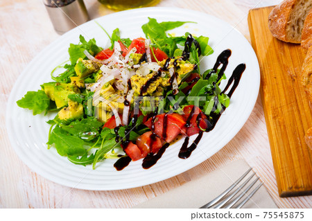 Vegetarian salad with tomatoes, avocado Vegetarian salad with tomatoes, avocado 75545875
