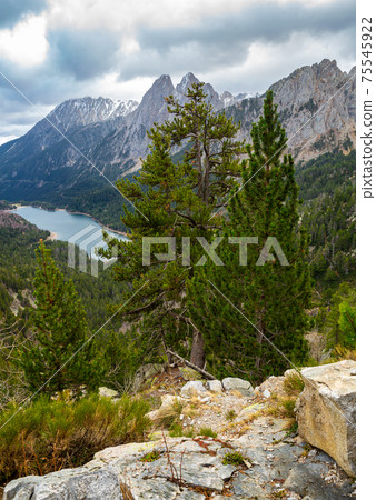Rocky landscape with Encantats peaks and Sant Maurici lake, Spain Rocky landscape with Encantats peaks and Sant Maurici lake, Spain 75545922