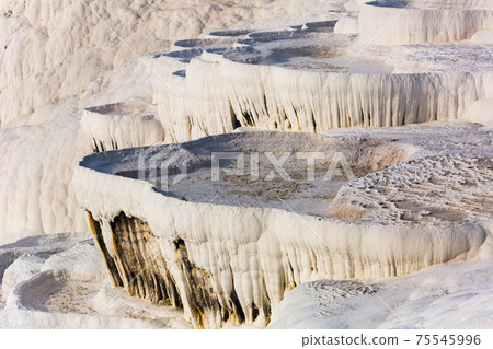 Travertines mountains of Pamukkale in Turkey. Travertines mountains of Pamukkale in Turkey. 75545996