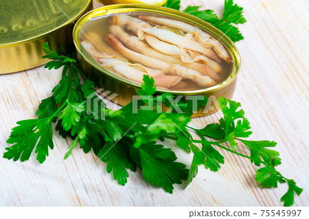 Canned natural mollusks Solen with parsley and lemon Canned natural mollusks Solen with parsley and lemon 75545997
