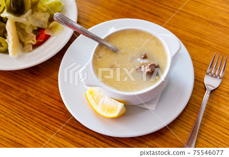 Turkish soup Paca corbasi served with pickle vegetables Turkish soup Paca corbasi served with pickle vegetables 75546077