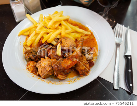 Stewed in sause rabbit with snails, served with french fries 75546211