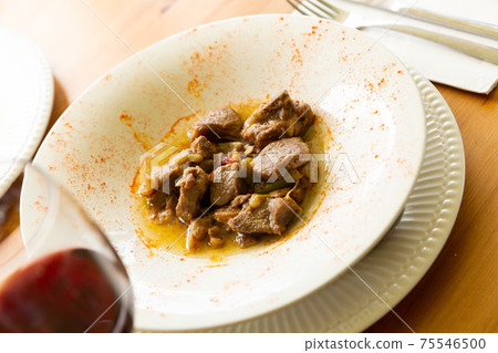 Appetizing lamb stewed with young garlic and paprika Appetizing lamb stewed with young garlic and paprika 75546500