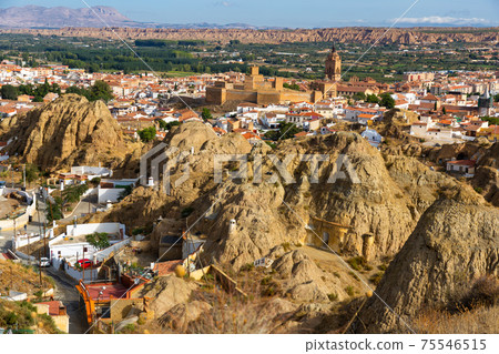 Neighborhood with troglodyte cave houses, Guadix, Spain Neighborhood with troglodyte cave houses, Guadix, Spain 75546515