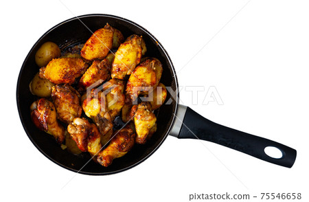 grilled chicken wings in skillet for lunch 75546658