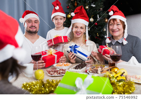 Happy family with Christmas gifts Happy family with Christmas gifts 75546992