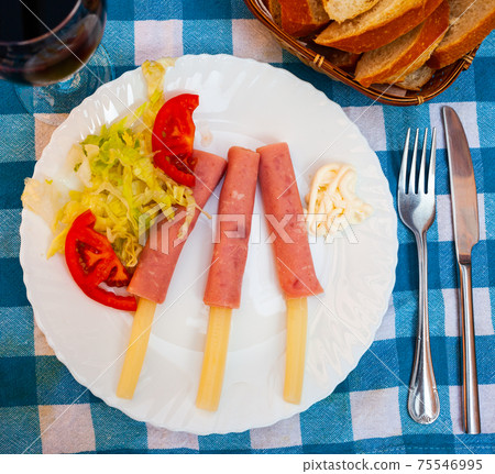 Deliciously asparagus rolls with ham and salad from vegetables Deliciously asparagus rolls with ham and salad from vegetables 75546995