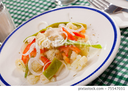 Appetizing cauliflower salad closeup Appetizing cauliflower salad closeup 75547031