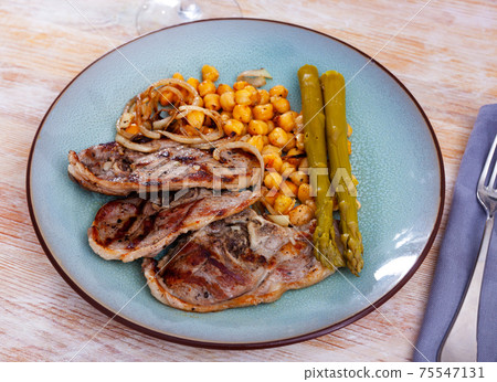 Lamb chop with chickpeas and asparagus Lamb chop with chickpeas and asparagus 75547131
