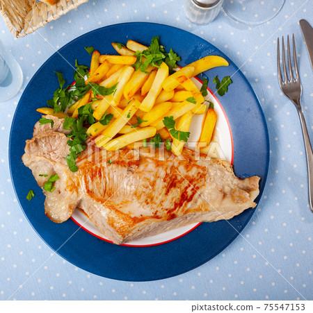 Appetizing fried pork with potatoes and herbs Appetizing fried pork with potatoes and herbs 75547153