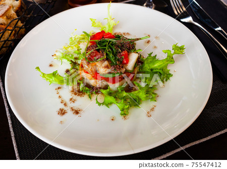 Codfish timbale with fried red peppers, arugula, olive oil 75547412