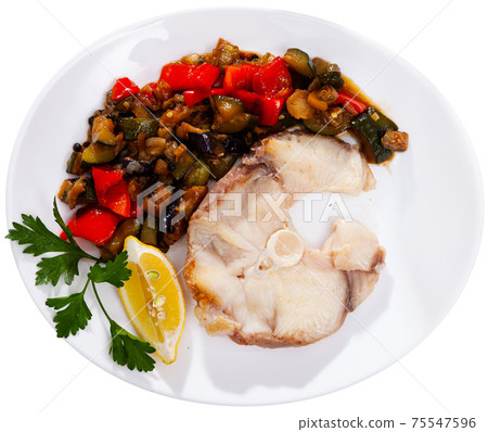 Fried steak of blue shark with baked vegetables and lemon Fried steak of blue shark with baked vegetables and lemon 75547596