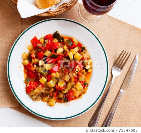 Healthy vegetarian dinner, braised vegetables on plate Healthy vegetarian dinner, braised vegetables on plate 75547605