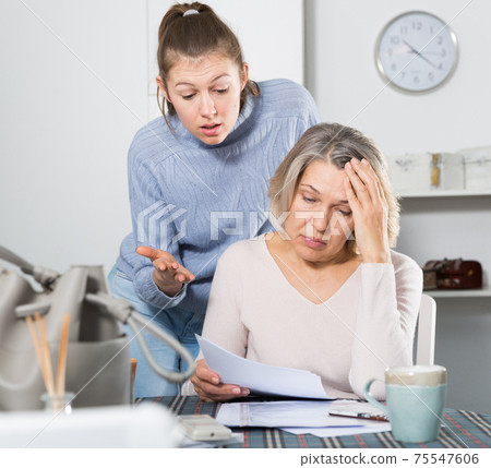 Unhappy woman with documents, family quarrel Unhappy woman with documents, family quarrel 75547606