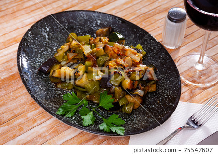 Healthy vegetarian dinner, braised vegetables on plate Healthy vegetarian dinner, braised vegetables on plate 75547607