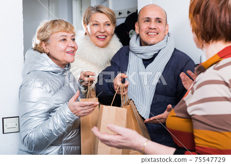Mature friends are talking about their leisure Mature friends are talking about their leisure 75547729