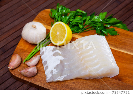 Raw fillet of pink cusk-eel with condiments Raw fillet of pink cusk-eel with condiments 75547731