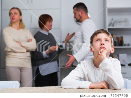 Sad boy during parents quarrel 75547796