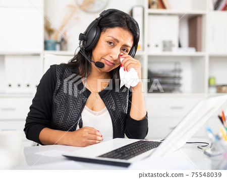 Frustrated woman customer support phone operator at workplace 75548039