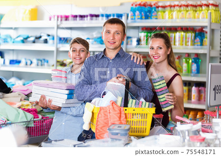 couple and teenager with household goods purchase in the store couple and teenager with household goods purchase in the store 75548171