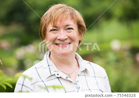 retiree woman portrait outdoors 75548328