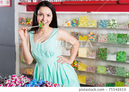 Portrait of sexy young girl with lollipop Portrait of sexy young girl with lollipop 75548919