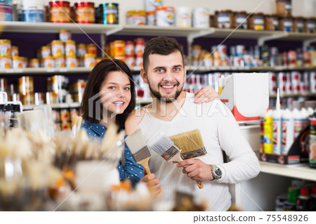 Couple choosing brush for house decoration Couple choosing brush for house decoration 75548926