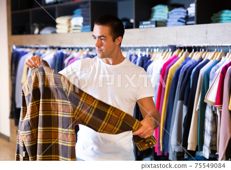 Man choosing shirt Man choosing shirt 75549084