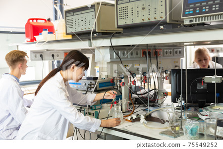 Positive Chinese female scientist at lab Positive Chinese female scientist at lab 75549252