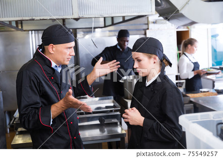 Chef dissatisfied with work of girl Chef dissatisfied with work of girl 75549257